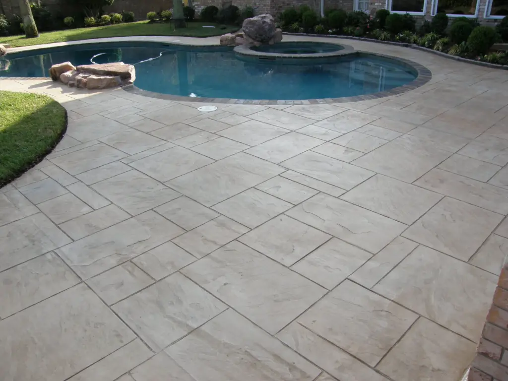 Stamped concrete patio and pool by Louisville company